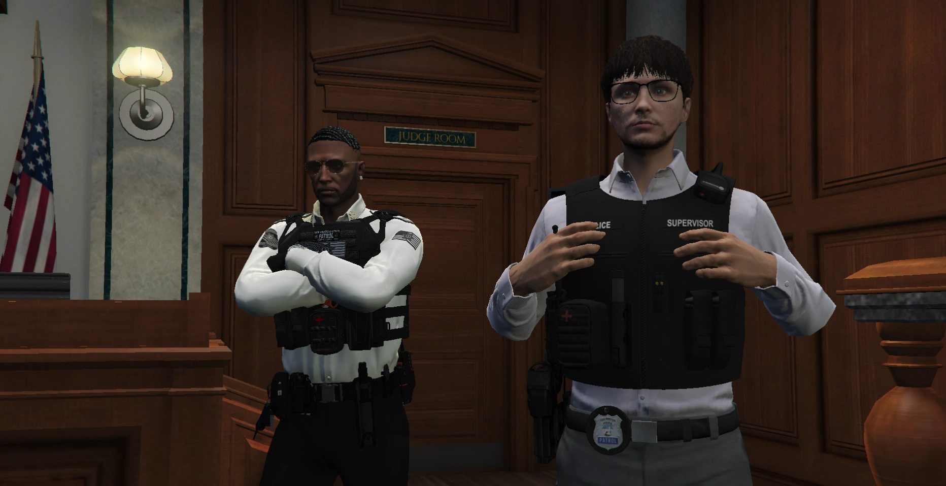 Two officers in a courtroom