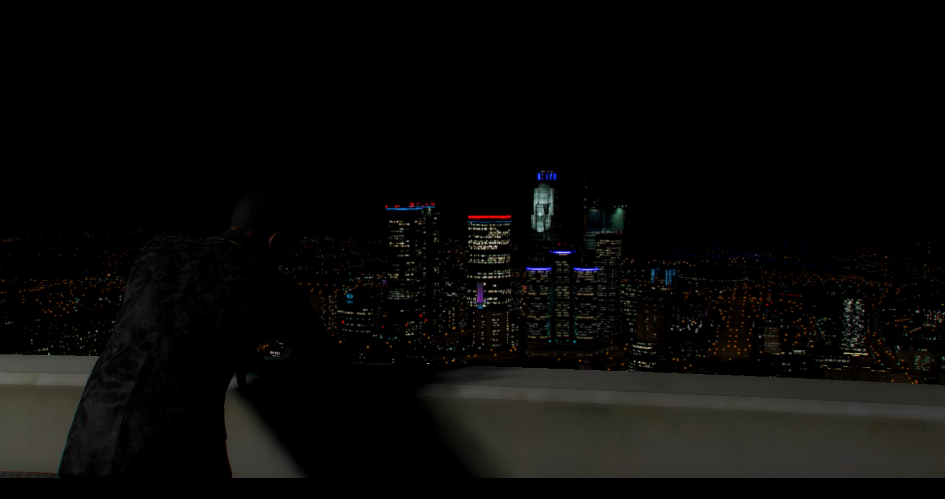 The city skyline at night from a rooftop