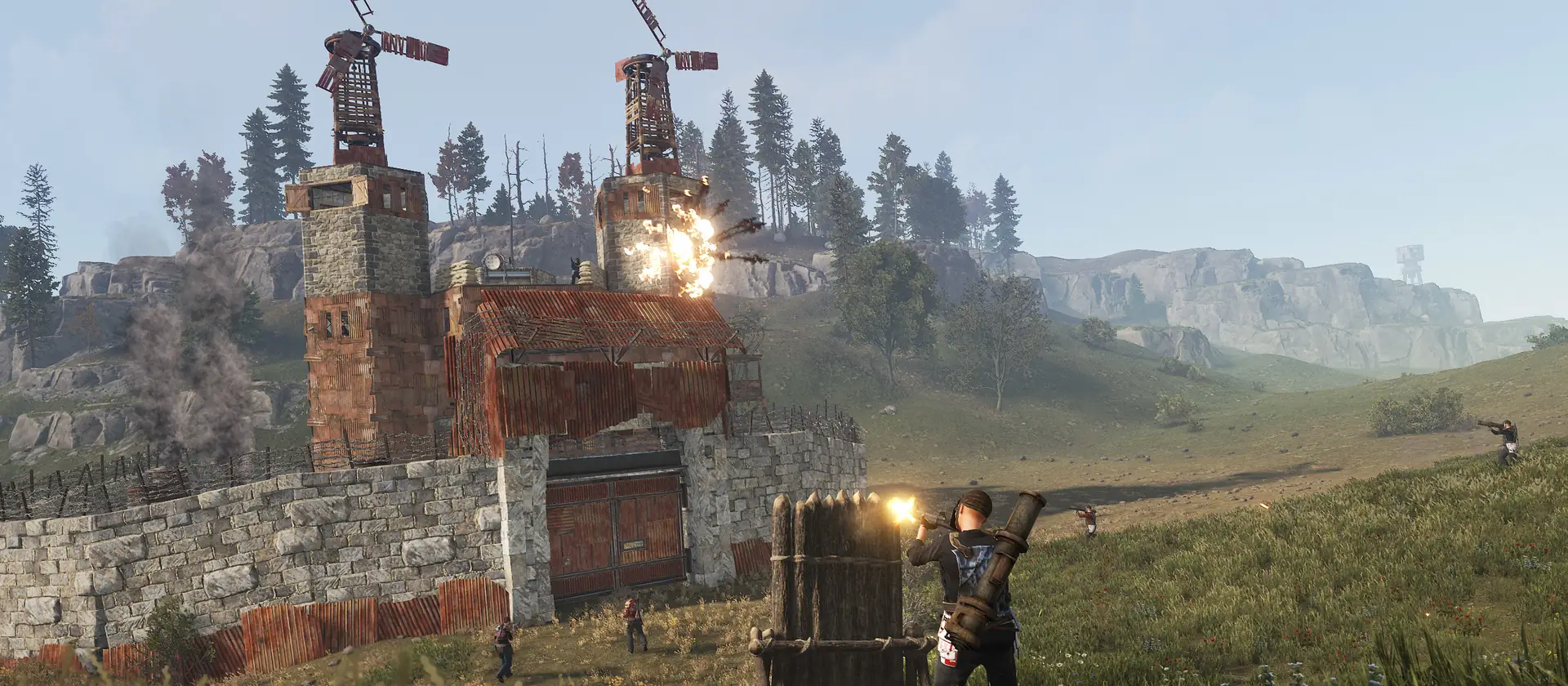 A walled base with windmills under attack